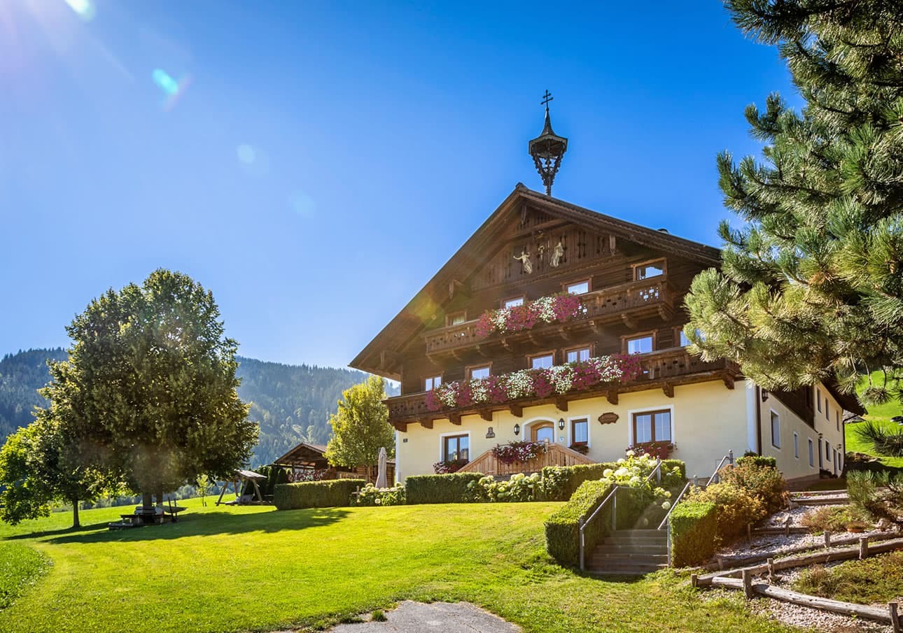 Farm Prechtlhof with beautiful flowers and meadows around the farm