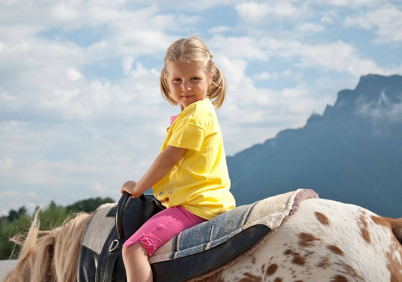 Child on a pony outdoors