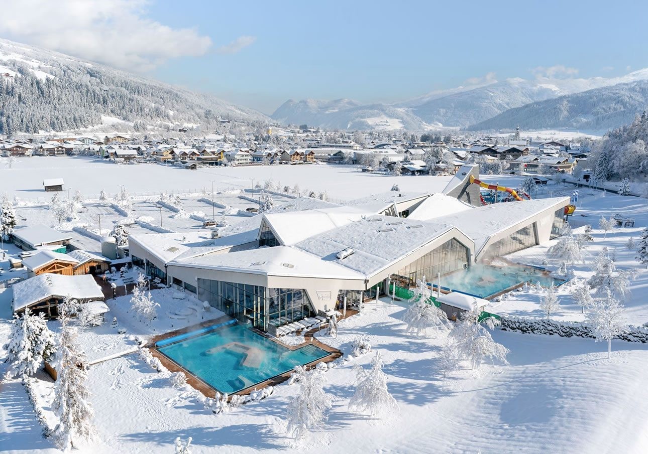Therme Amadé in Altenmarkt with heated outdoor pool in a snowy mountain landscape